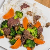 Beef Broccoli · Beef sautéed with fresh broccoli, mushrooms and carrots in house oyster sauce.
