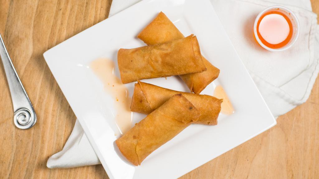 Vegetable Rolls · Crispy spring rolls, stuffed with vegetables, served with sweet chili sauce.