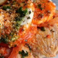 Chicken Caprese · Grilled chicken, fresh mozzarella, fresh basil & fresh tomato on a rustique roll.