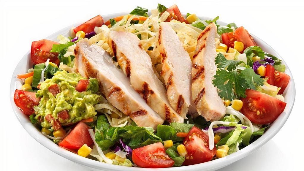 Southwestern Chicken Salad · Grilled chicken served on top of spring sweet greens with Jack cheese, tomatoes, corn, guac, cilantro and tortilla strips.