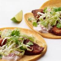 Blackened Fish Taco · Corn tortillas, Blackened fish, Chipotle sour cream, crisp slaw, cilantro and a fresh lime w...