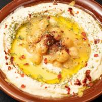 Hummus · Mashed chickpeas blended with tahini, olive oil, lemon juice, salt and garlic. Served with a...