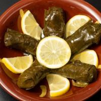 Stuffed Grape Leaves · Stuffed with a savory mixture of tomatoes, onions, rice and seasoning. Served with a side of...