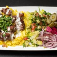 Beef Kabob Platter · Seasoned beef with grilled vegetables on a bed of rice.