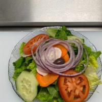 Garden Salad · Romaine lettuce, tomatoes, radishes, cucumbers, carrots, onions, and olives.