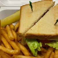 Turkey Club W/Fries · Freshly made with cheese, bacon, lettuce, tomato, and mayonnaise, layered between toasted br...