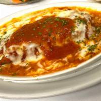 Baked Homemade Lasagna · Meat lasagna with pomodoro sauce, topped with provolone cheese.