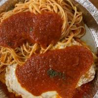 Chicken Parmigiana · Breaded chicken baked with provolone cheese and pomodoro sauce, served with a side of pasta.