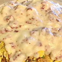 Messy Scrambler · Scrambled Eggs w/ Bacon Sausage, Onion & Green Peppers over Home fries then topped w/ Chedda...