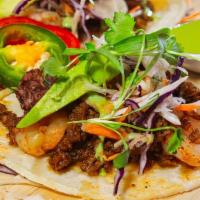 Tacos De Mariscos · Octopus, shrimp, chorizo, avocado and cilantro, red cabbage