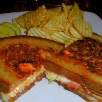 Grilled Reuben Sandwich · Corned beef, coleslaw, Russian dressing, Swiss cheese and rye.