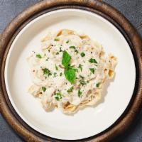 Alfredo De Lucca Pasta (Fettuccine) · Fettuccine pasta tossed in creamy white sauce topped aged parmesan. Served with bread.