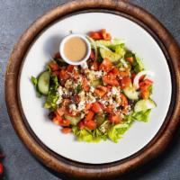 Gods' Greek Salad · Fresh lettuce, feta cheese, cucumber, tomatoes, banana peppers, green peppers, Kalamata oliv...