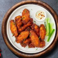 Chicken Wings · Fresh chicken wings breaded and fried until golden brown. Served with a side of ranch or ble...