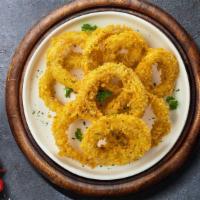 Onion Rings · (VEG) Sliced onions dipped in a light batter and fried until crispy and golden brown.