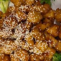 Crispy Sesame Chicken · Diced chicken lightly dipped in lotus flour, sautéed in special brown sauce with sesame seed...