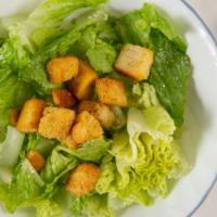 Caesar Salad · Pita bread, romaine lettuce, croutons, and Parmesan.