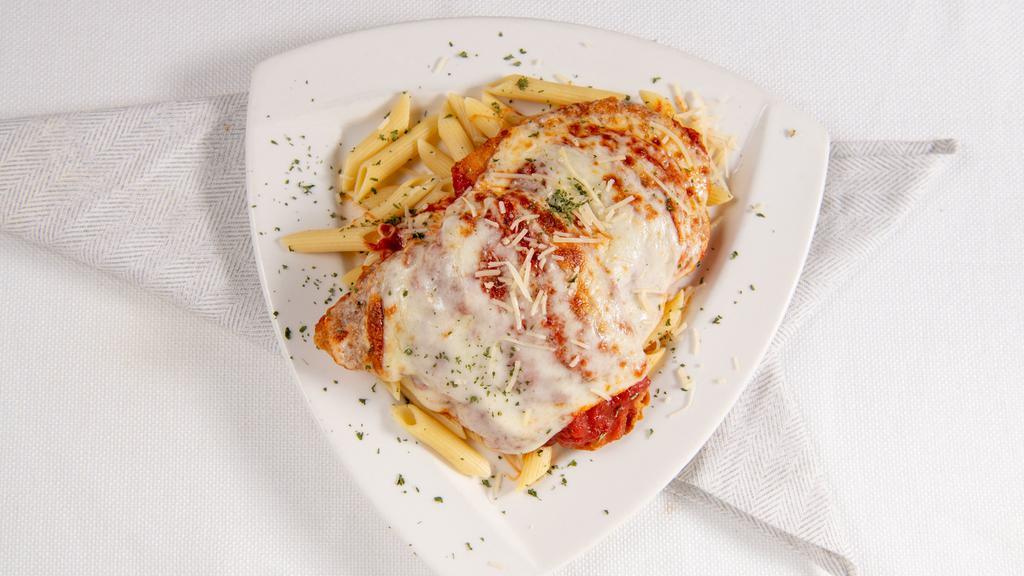Chicken Parmigiana
 · Lightly fried chicken topped with marinara sauce and mozzarella cheese; served over penne.