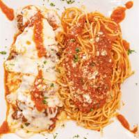 Chicken Parmigiana · Topped with melted cheese and sauce.