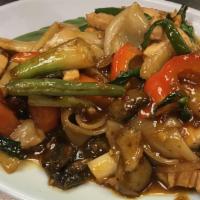 Drunken Noodles Chicken · Wide rice noodles with Thai chilies, onions, mushrooms, and basil. Spicy