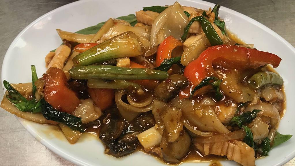 Drunken Noodles Chicken · Wide rice noodles with Thai chilies, onions, mushrooms, and basil. Spicy