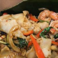 Drunken Noodles Shrimp · Wide rice noodles with Thai chilies, onions, mushrooms, and basil. Spicy