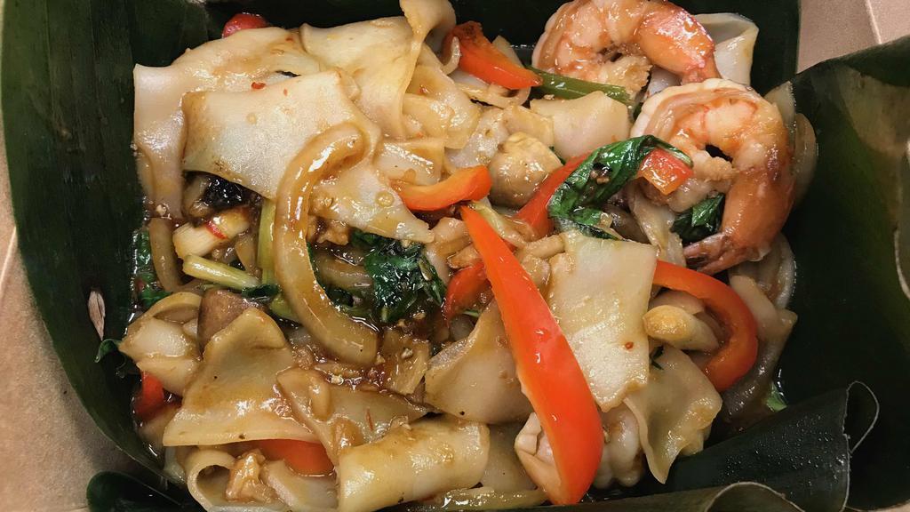 Drunken Noodles Seafood · Shrimp and Scallops. Wide rice noodles with Thai chilies, onions, mushrooms, and basil. Spicy