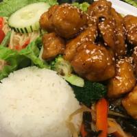 Crispy Chicken · Tender fried chicken with a tangy spicy sauce, broccoli, and dried chilies. Served with rice