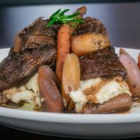Brisket Bourguignon · Slow cooked beef brisket, baby carrots, roasted garlic mashed potato,  red wine demi glace.