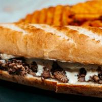 Philly Steak Sub · Premium grilled steak, melted cheddar cheese, and fried onions.