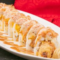 Lowell Maki · Shrimp tempura, cheese, avocado and mango with soy paper topped with spicy crab.