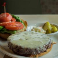 Cheeseburger · A 3/4 lb beef burger grilled to your liking in a brioche roll, topped with choice of cheese,...