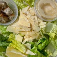 Caesar Salad · Crisp romaine, shaved parmesan, lemon wedge, and croutons. Homemade Caesar dressing on the s...