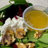 Baby Spinach Salad · Baby spinach, goat cheese, walnuts, dried cranberries, with a homemade raspberry vinaigrette...