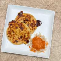 Pupusas · Handmade tortilla, stuffed with mozzarella cheese, pork or beans or just cheese. Served with...