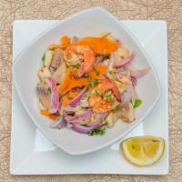 Ceviche De Pescado, Calamares Y Caniarones · Fresh fish, squid, and shrimp marinated in natural lemon juice, red onions, jalapeno peppers...