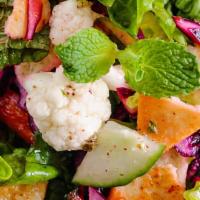 Fatoush Salad · Romaine lettuce, tomatos, cucumber, onion, and pita chips.