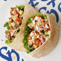 Chicken Shawarma Pita · Chicken shawarma with lettuce, tomatoes, cucumber, onions, and your choice of sauce wrapped ...