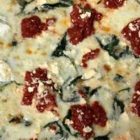 Mediterranean Pizza · Spinach, marinated tomatoes, garlic, olive oil, Mozzarella and Feta cheese.