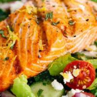 Grilled Salmon Salad · Grilled 8 oz. salmon and shrimps over garden or caesar salad.