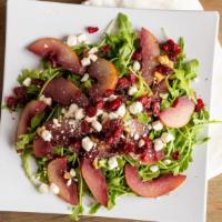Pear Salad · Cranberry, goat cheese, walnuts, arugula, tomatoes and raspberry dressing.