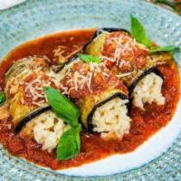 Eggplant Rollatine · Eggplant breaded, rolled up and stuffed with ricotta cheese, grated Romano and topped with s...