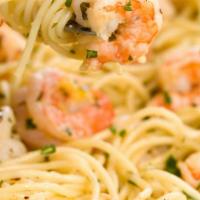 Shrimp Scampi · Over linguini pasta, fresh diced tomatoes, parsley in white wine sauce.