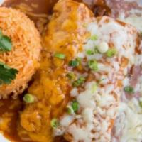 Mole Enchiladas · Contains peanut butter. Two soft enchiladas stuffed with shredded chicken and topped with ou...