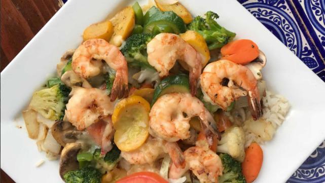 Mexicali Stir-Fry · Choice of chicken or shrimp sautéed with mushrooms, onions, carrots, broccoli and green peppers. Covered with melted Jack cheese and served over rice.
