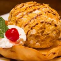 Deep Fried Ice Cream · Vanilla ice cream in a crispy coating topped with chocolate sauce and whipped cream.