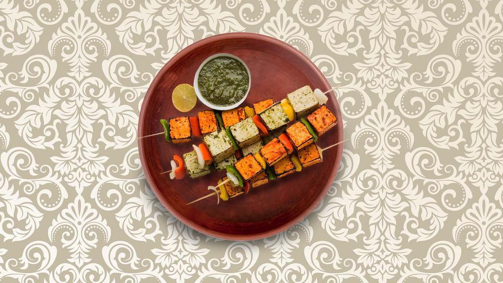 Blazing Cottage Cheese · An appetizer made of diced cottage cheese cubes marinated in Indian spices and grilled in an Indian clay oven. Served with a side of our homemade fresh mint relish.