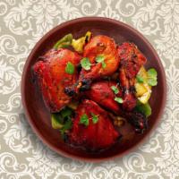 Clay Pot Chicken Tandoori · Spring chicken marinated in yogurt and spices and grilled in a Indian clay oven.