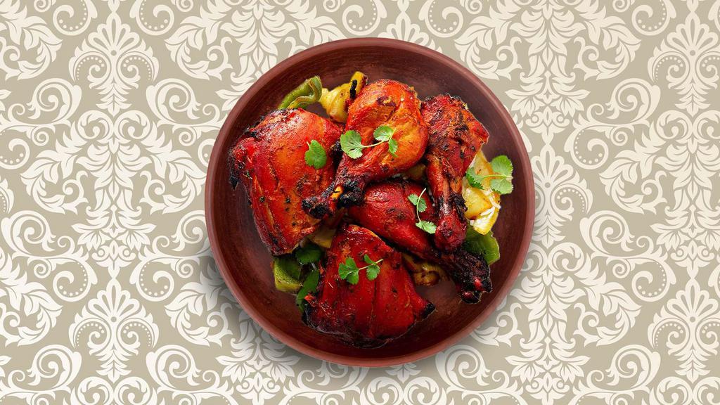 Clay Pot Chicken Tandoori · Spring chicken marinated in yogurt and spices and grilled in a Indian clay oven.