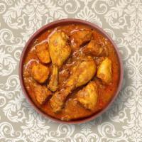 Clay Pot Chicken Curry  · Marinated chicken stewed in an onion- and tomato-based gravy, flavored with ginger, garlic, ...